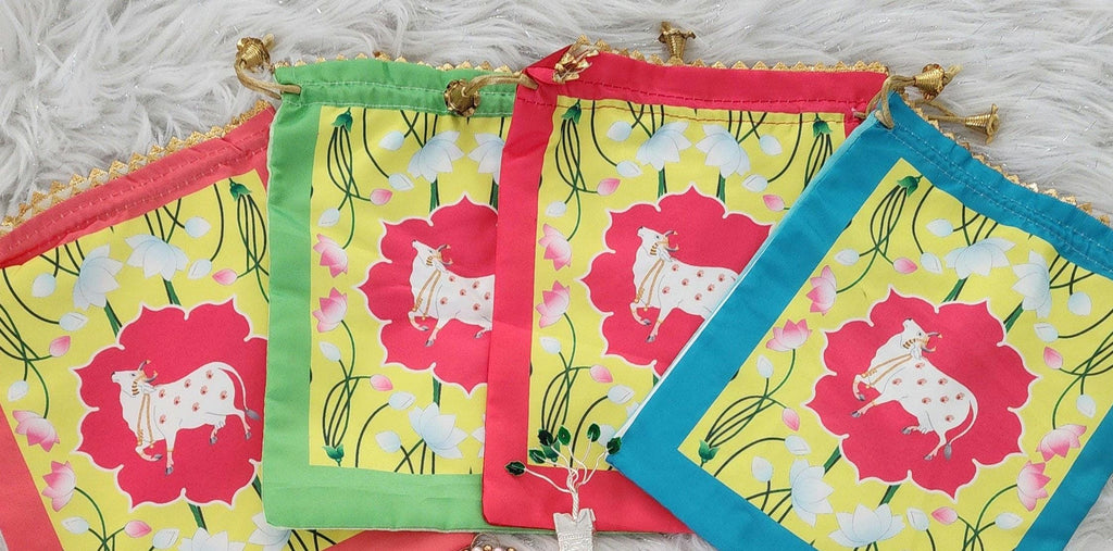 Pichwai Print Potli Bag Set: Nandi Jar & Haldi Kumkum Plate.