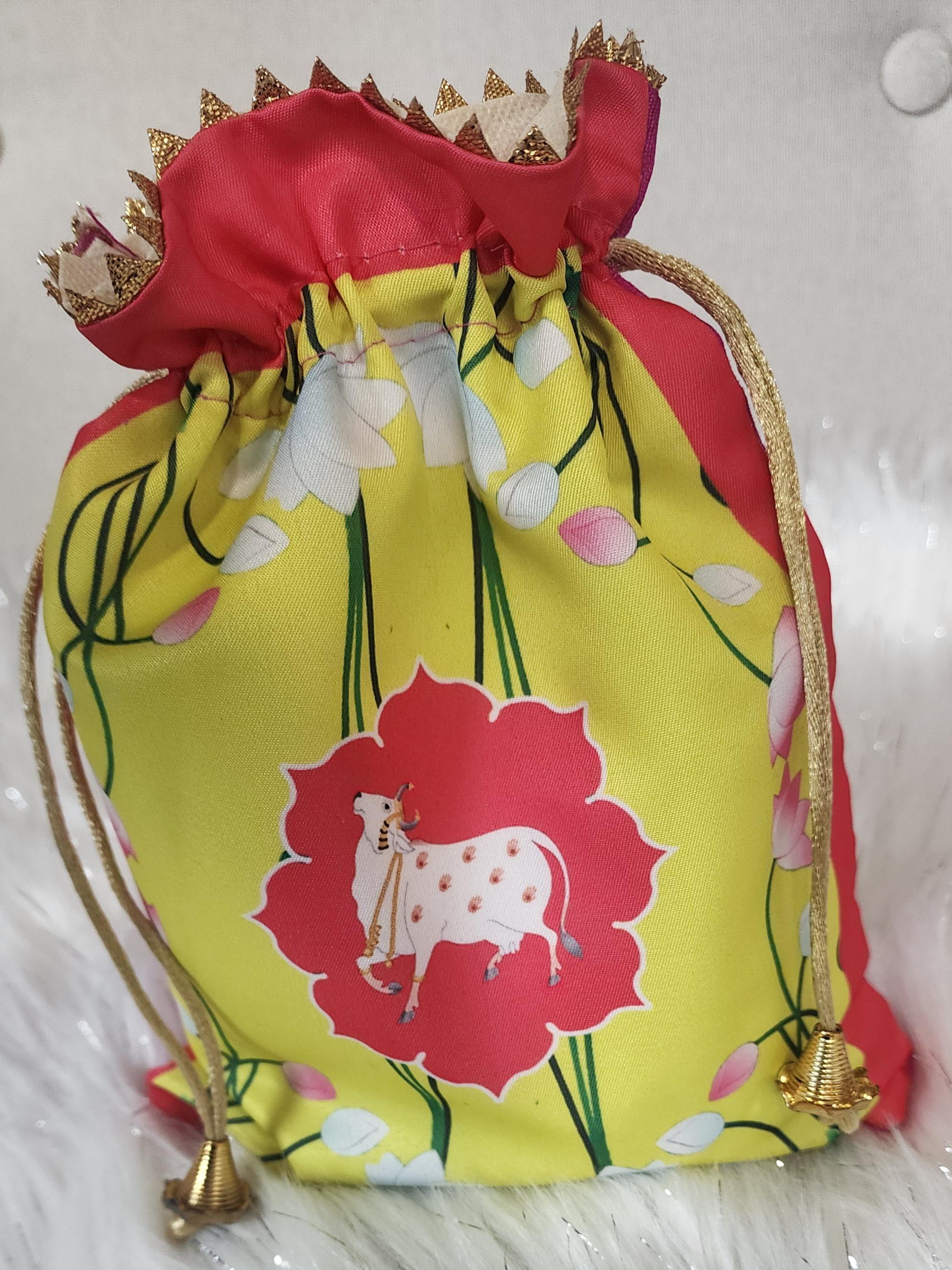 Pichwai Print Potli Bag Set: Nandi Jar & Haldi Kumkum Plate.