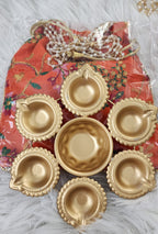Metal Urli with 7 Diyas and Embroidered Potli Bag: Diwali Decor, 7-inch