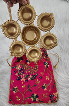 Metal Urli with 7 Diyas and Embroidered Potli Bag: Diwali Decor, 7-inch
