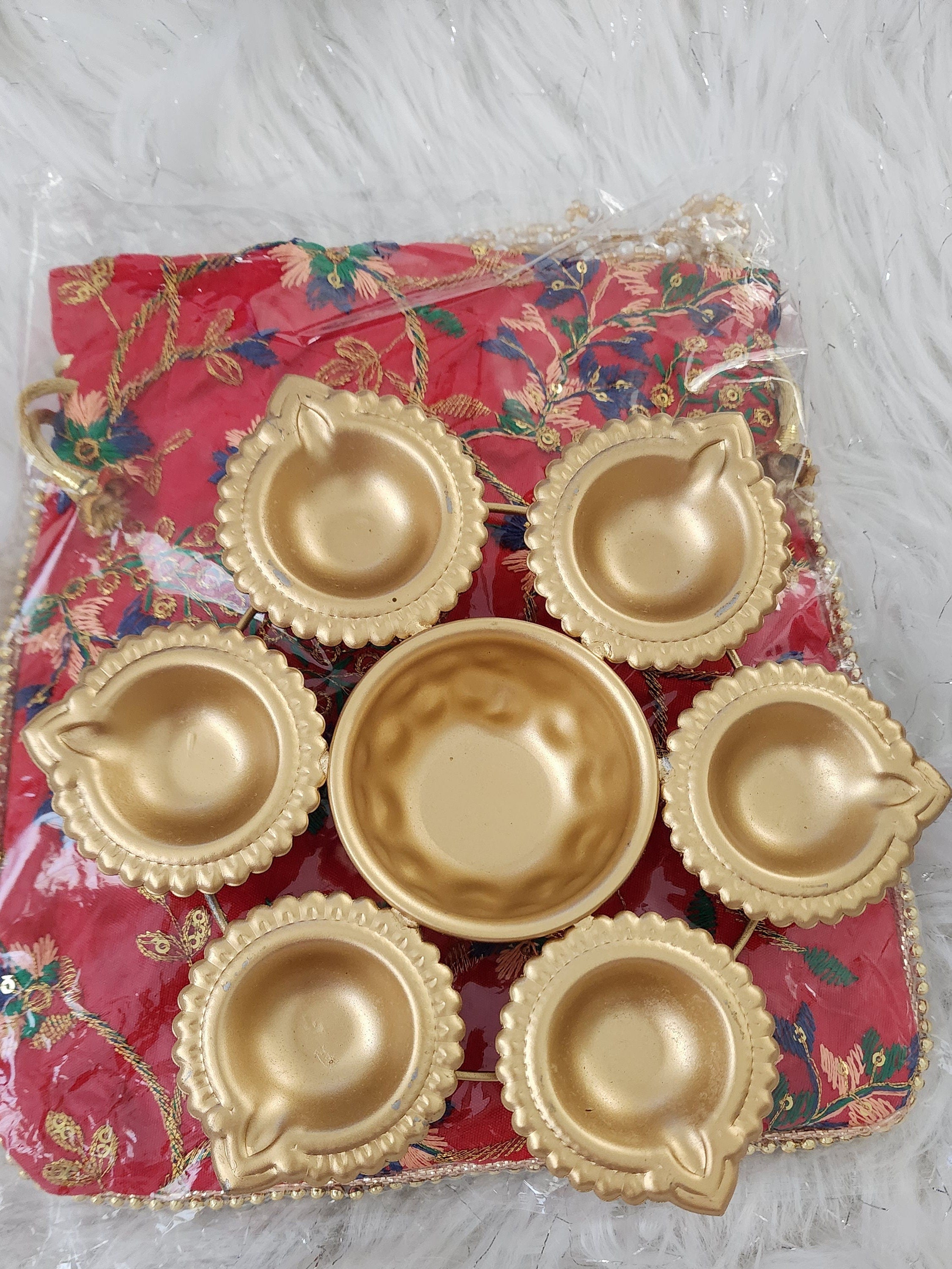 Metal Urli with 7 Diyas and Embroidered Potli Bag: Diwali Decor, 7-inch