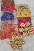 Metal Urli with 7 Diyas and Embroidered Potli Bag: Diwali Decor, 7-inch